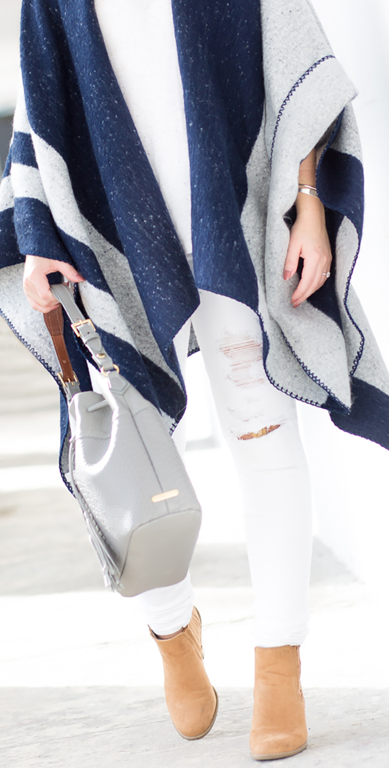 navy and grey poncho, white ripped denim for fall