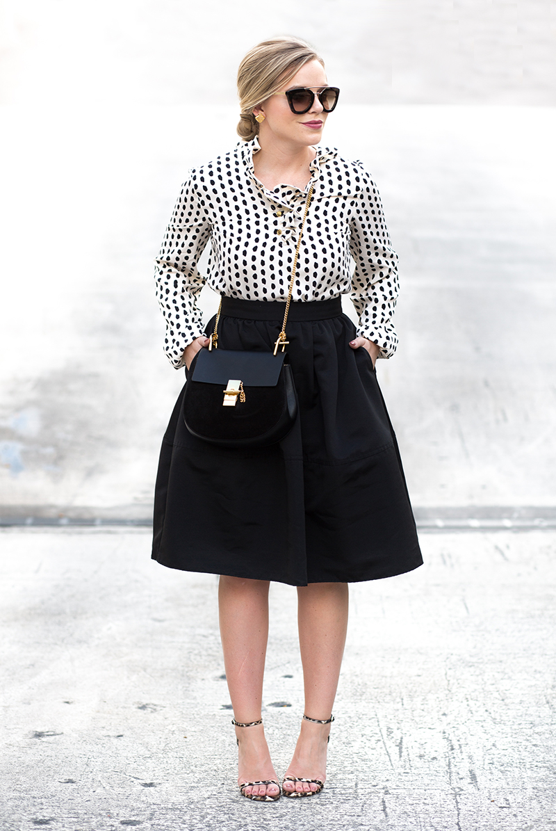 ruffled dotted blouse, black full skirt
