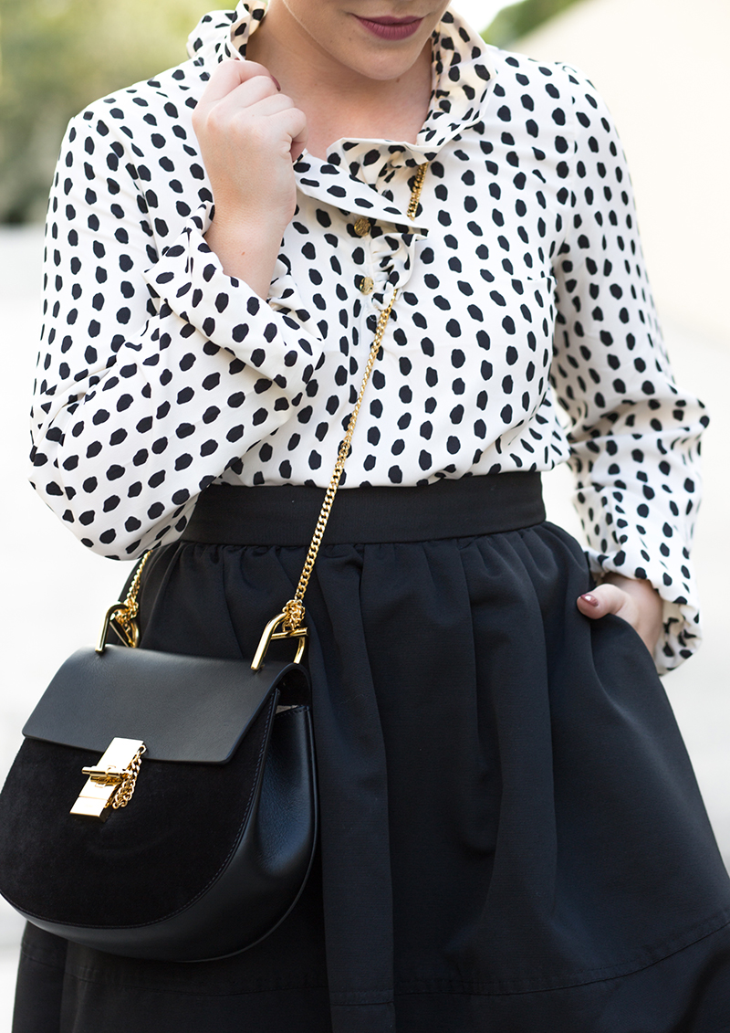 ruffled dotted blouse, black full skirt
