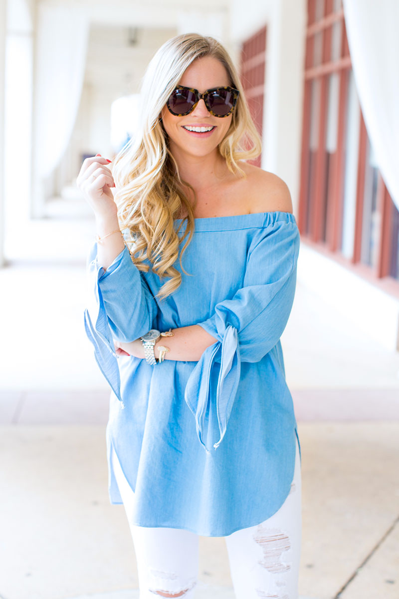 light blue off-the-shoulder tie sleeve top and white denim